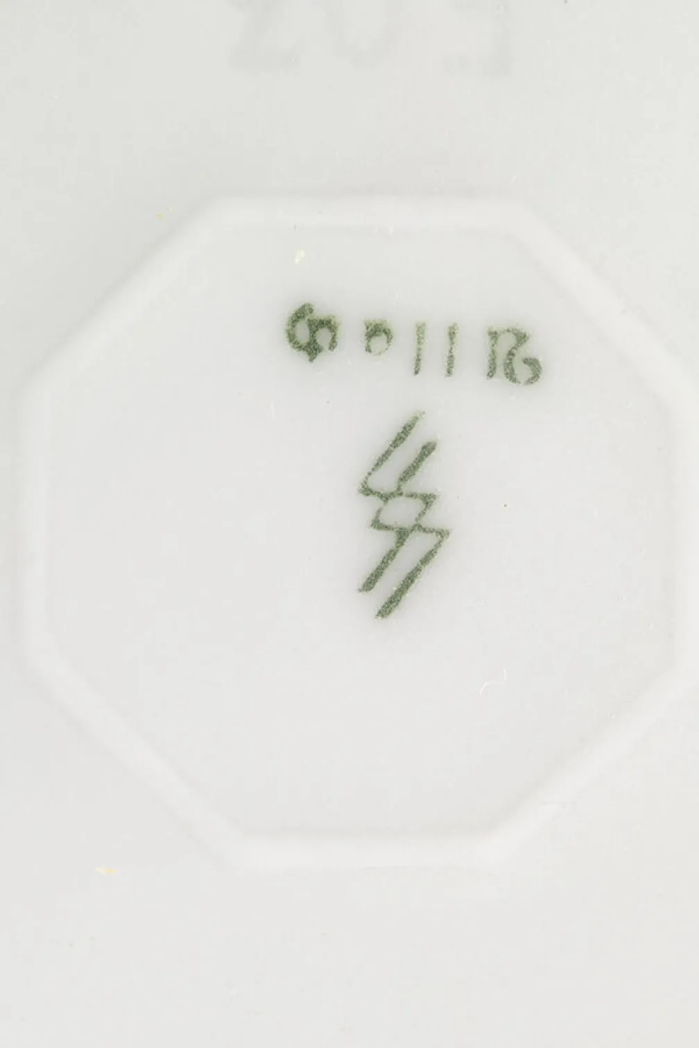 Stamp on the bottom of the vase, Slave Labour and Genocide