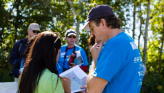 ROM scientist Kevin Seymour looks at a map with the bird team at the 2012 Ontario BioBlitz in Rouge park, deciding where the team will survey