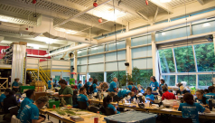 Wide view of the species depot at the 2015 Ontario BioBlitz, where scientists bring back specimens to examine and identify along tables with microscopes and field guides. Photo by Krystal Seedial