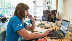 Angela Telfer, database coordinator for the Ontario BioBlitz program sits hard at work at a computer in the middle of the species depot during the 2015 event. Photo by Stacey Lee Kerr