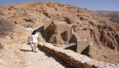 View of the old monastery buildings from the South in 2004, with then Brother Jihad, a member of the monastery.