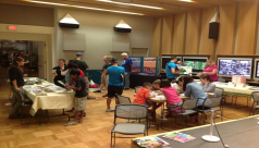 Families gather around tables in the Earth Rangers Studio