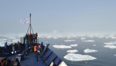 A view over ice floes in the Arctic Ocean from the bow of a Students On Ice Boat in 2011. Photo by Mary Paquet