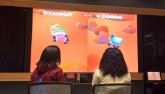 Two kids testing a ROM Game Jam video game