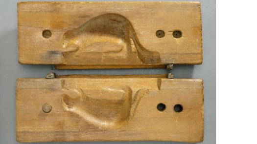 a wooden sugar mould in the shape of a beaver
