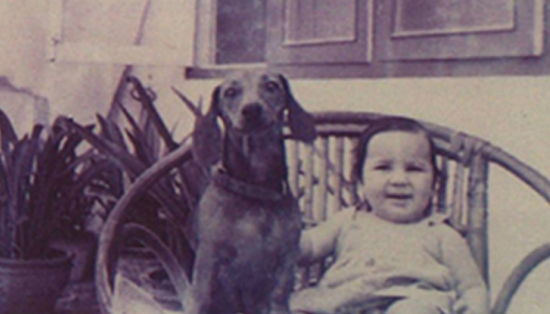 Deepali Dewan with her dog Tipsy on a wicker garden chair.