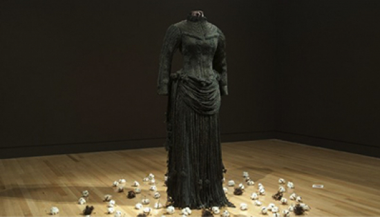 A black Victorian mourning dress made from hundreds of braids of synthetic hair.