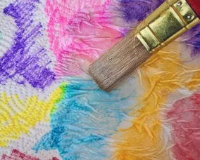 Painting coloured paper towel.