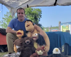 Chad Solomon with characters Rabbit and Bear Claw