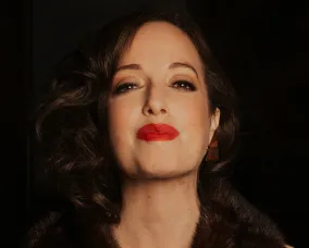 Headshot of a young woman with dark hair.
