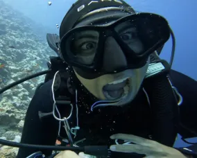 Woman in scuba suit underwater