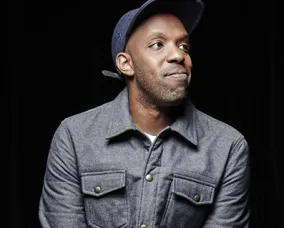 image of Shad looking to the right on a black background