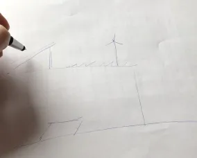 Un élève dessine le plan de son école durable