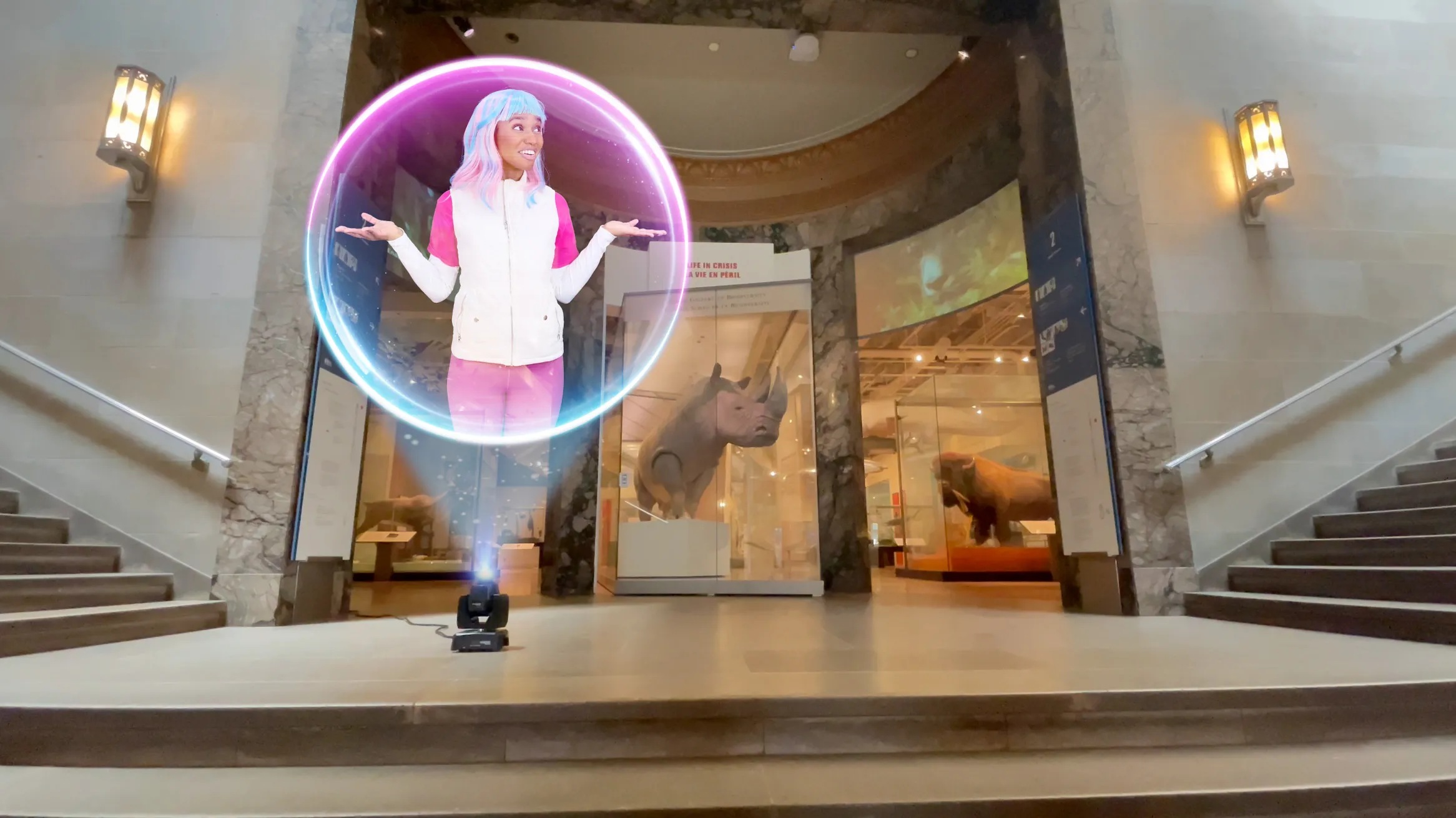 A holographic projection of ECO, the Earth Rangers Communications Operative with colorful hair and a white and pink outfit, appears inside a glowing orb at the Royal Ontario Museum entrance, where she shares engaging lessons about biodiversity and wildlife conservation with visitors.