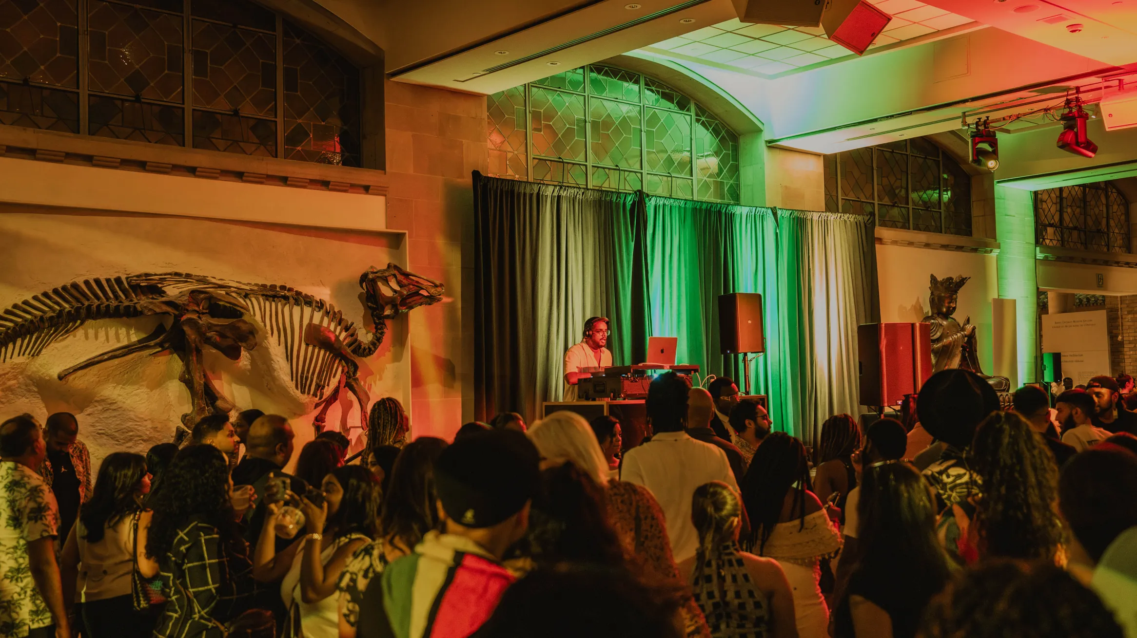 A dj performing at a museum.