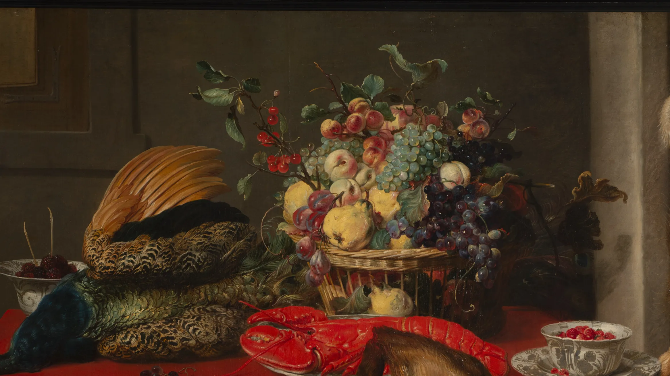 Detail of painting depicting game and fruit laid on a table.