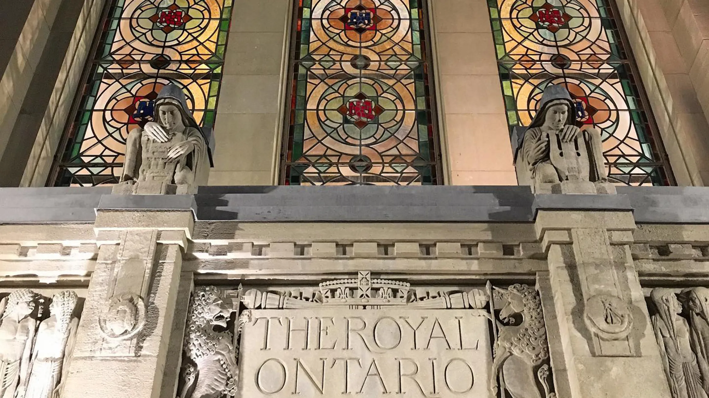 Image of the exterior Queen's Park entrance stained glass windows and architecture