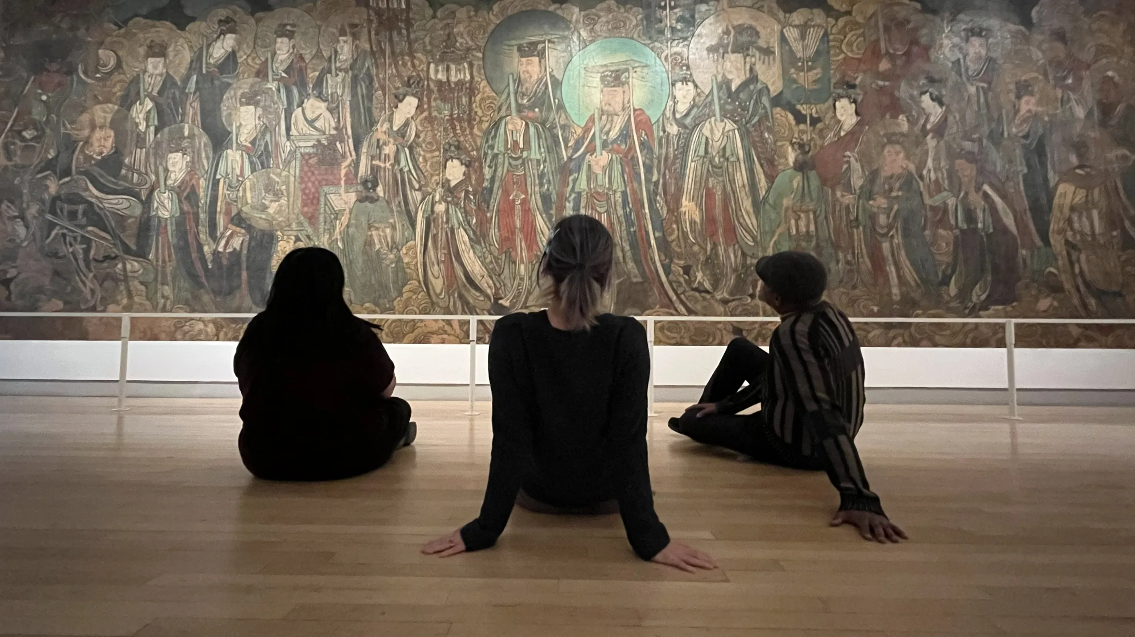 Looking at the mural in the ROM's Bishop White Gallery