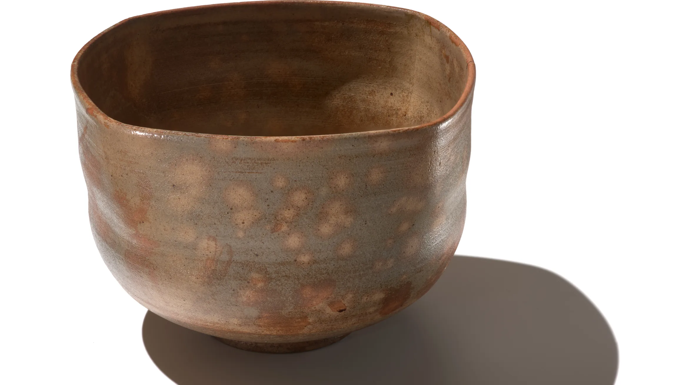 Rounded square tea bowl with flowing glaze