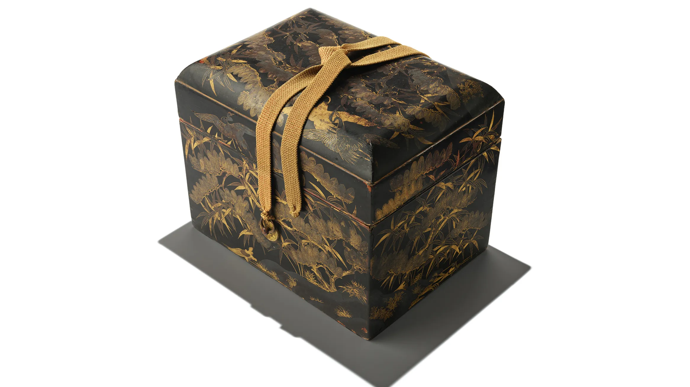 Te-bako (cosmetic box) with pine tree, bamboo, crane, and turtle motifs. Momoyama period 1575-1600 AD. Japan. Lacquered wood with maki-e gilding and brass fittings.