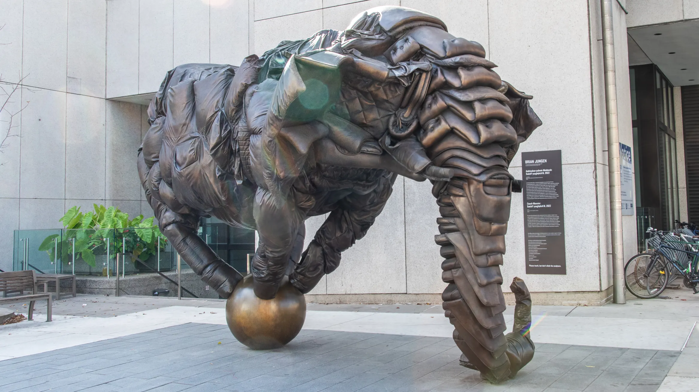 Artwork with figure balanced on a ball